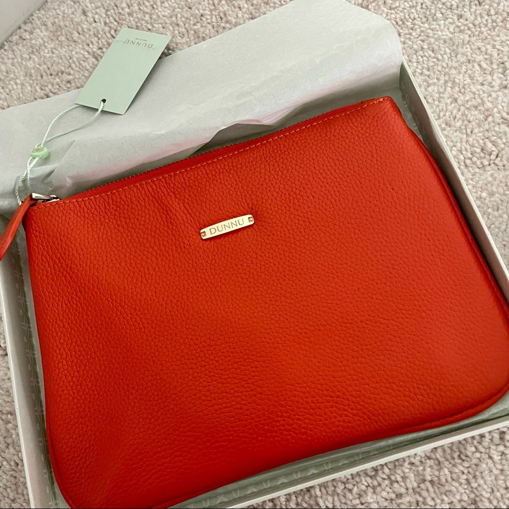 NWT Dunnu orange leather clutch